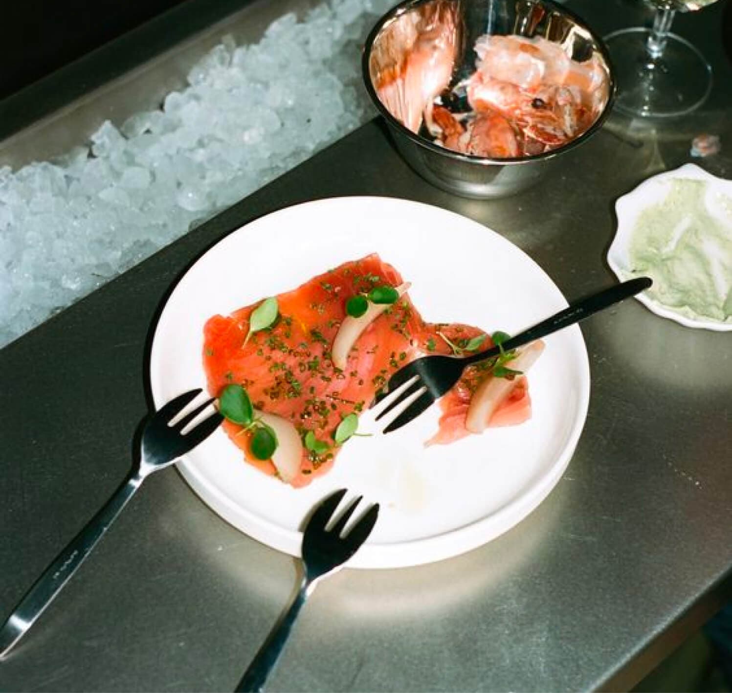 plate of food with 3 forks.