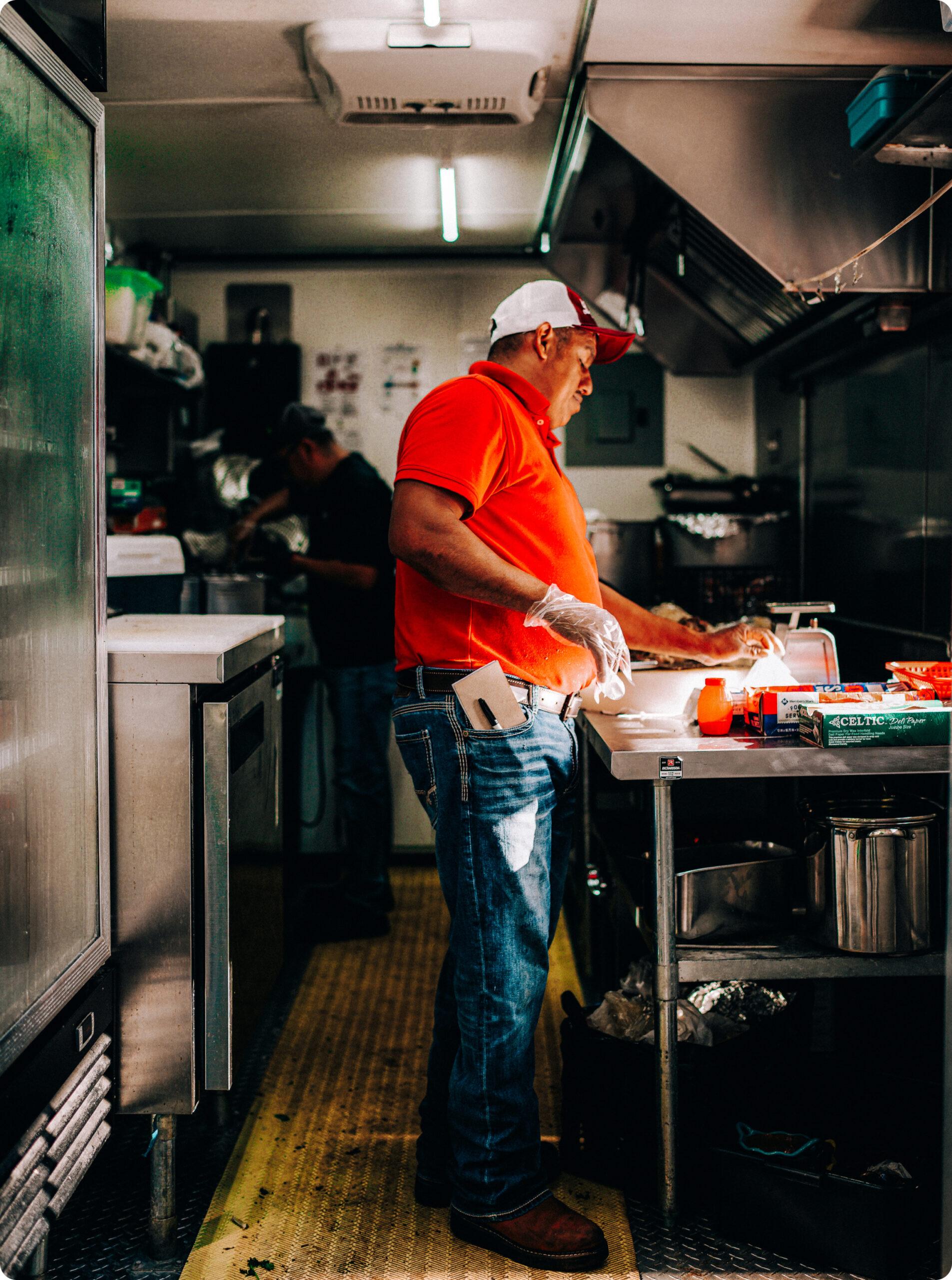 Man flipping burgers