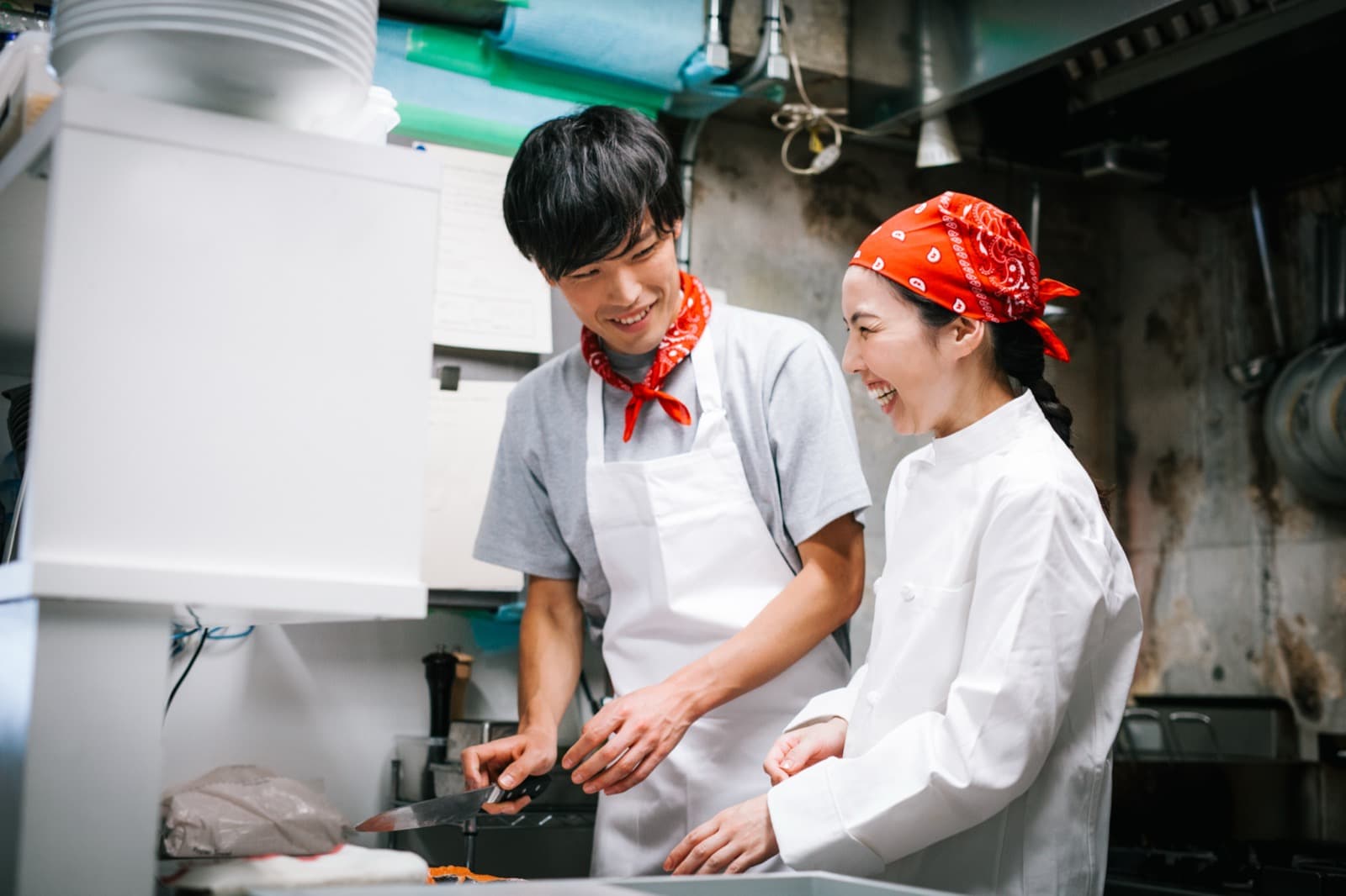 A restaurant team sharing a laugh together at work