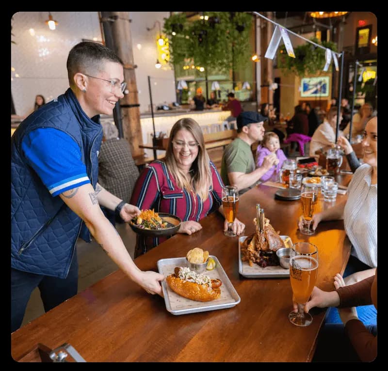 Restaurant staff serving customers