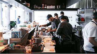 Kitchen team working the line during service