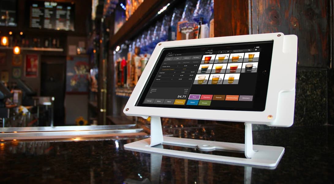 Tablet with menu displayed at bar counter.