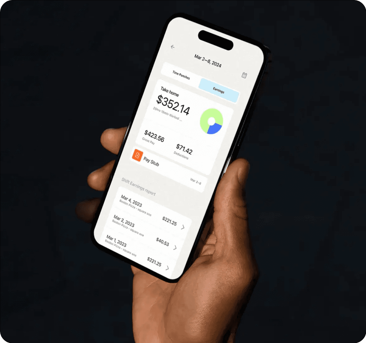 Hand holding smartphone showing earnings summary screen.