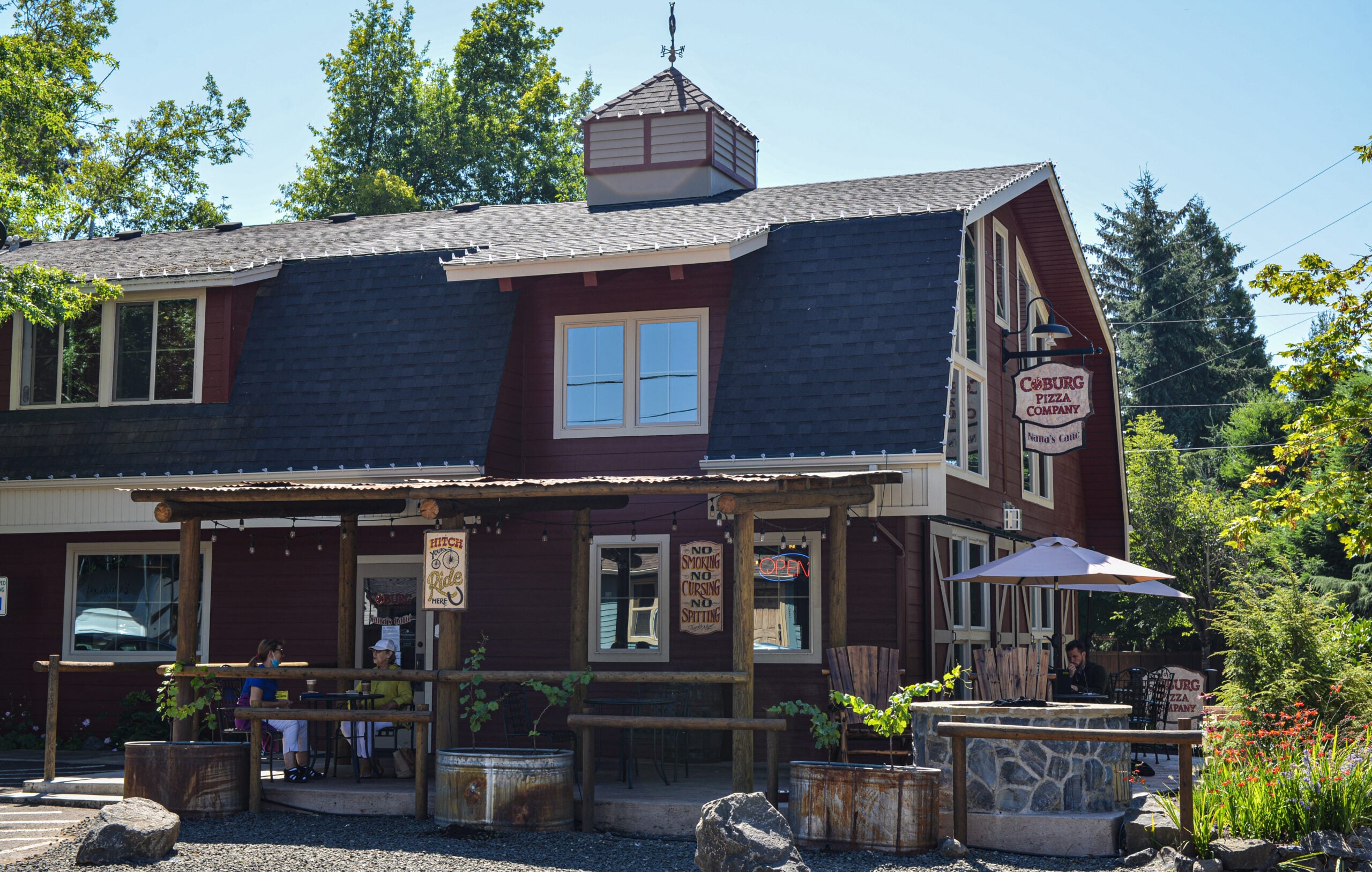 Coburg Pizza Company building with outdoor seating.