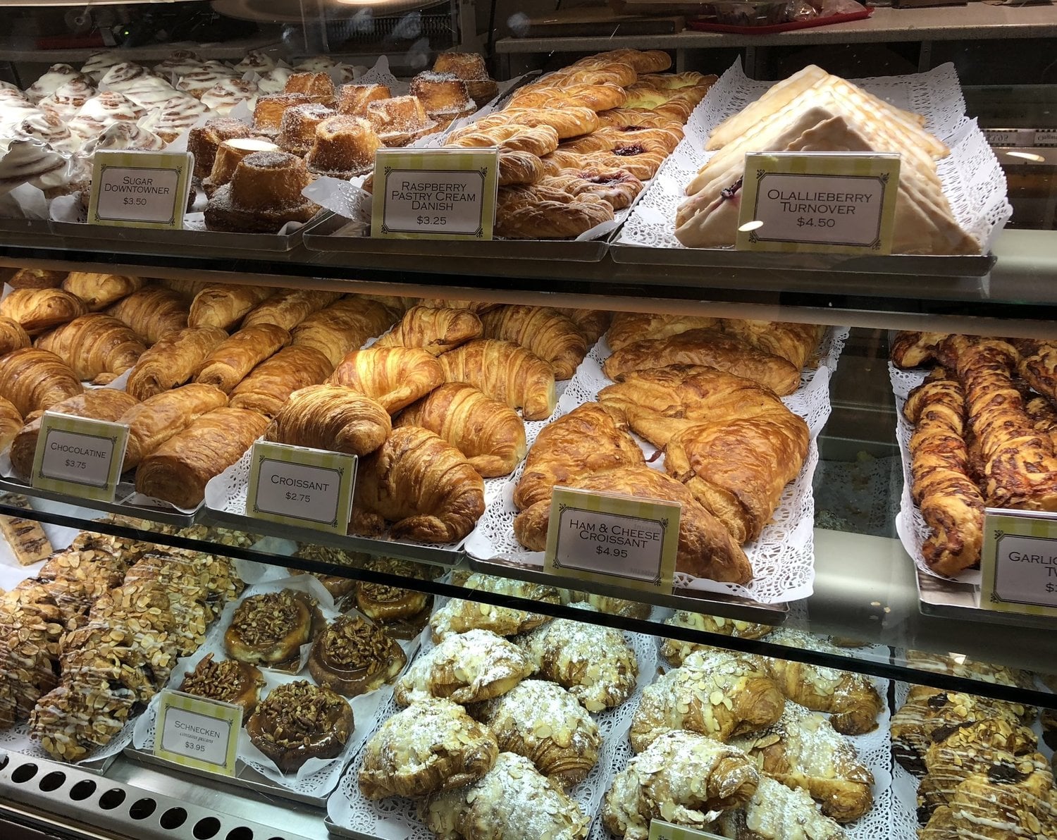 Display of various pastries in a bakery.