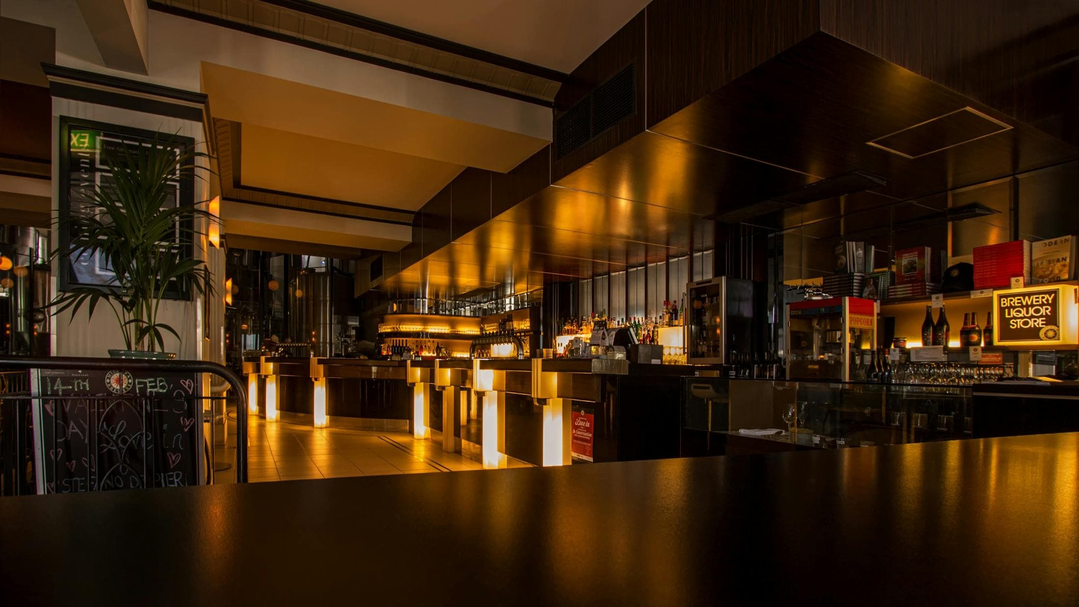 Modern bar interior with dim lighting.