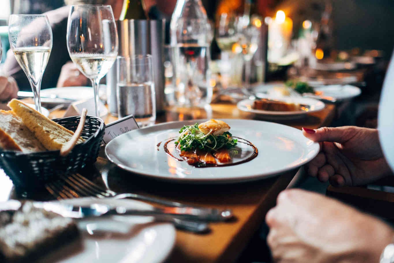 Gourmet dish served with wine in a restaurant.