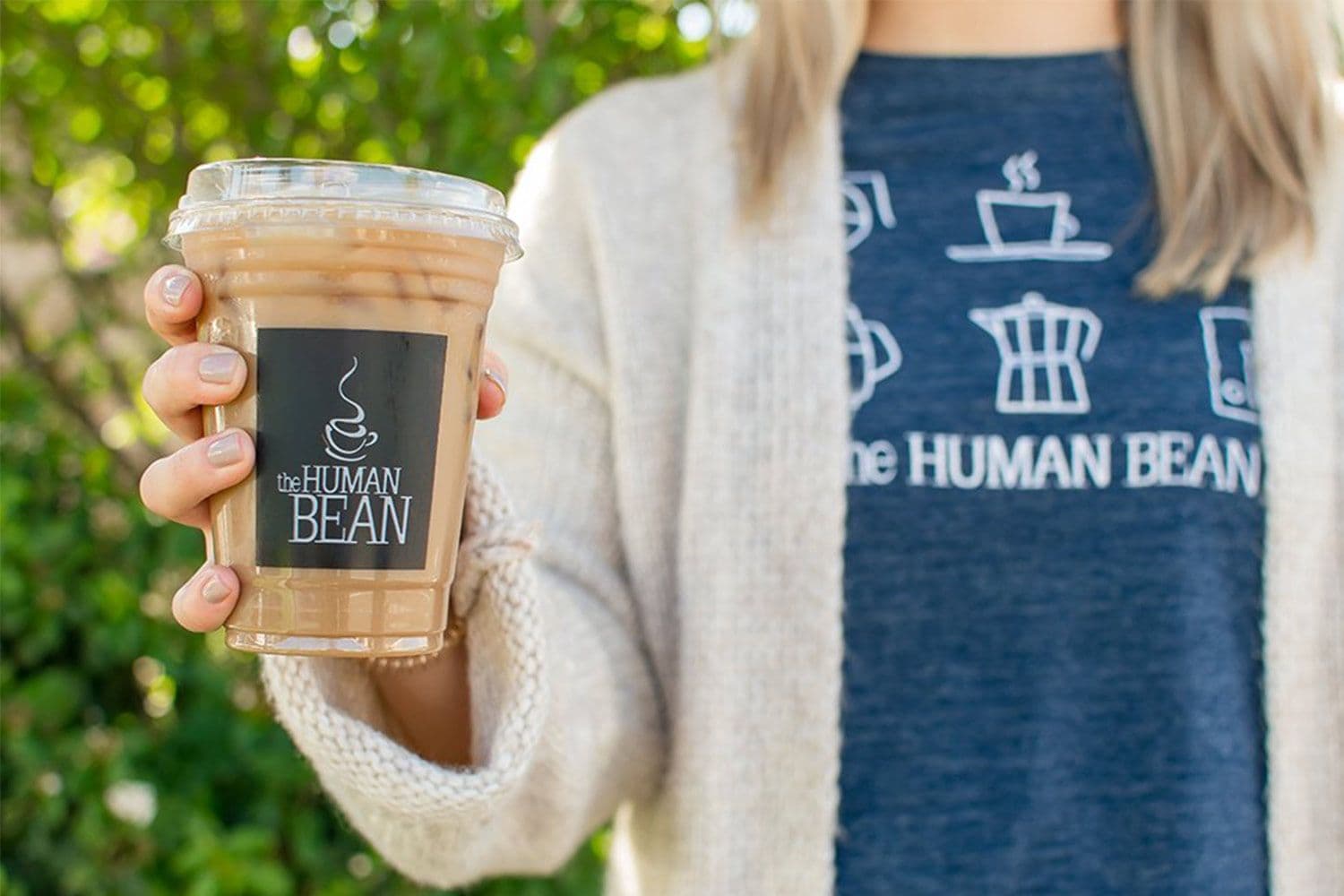 Person holding iced coffee from The Human Bean