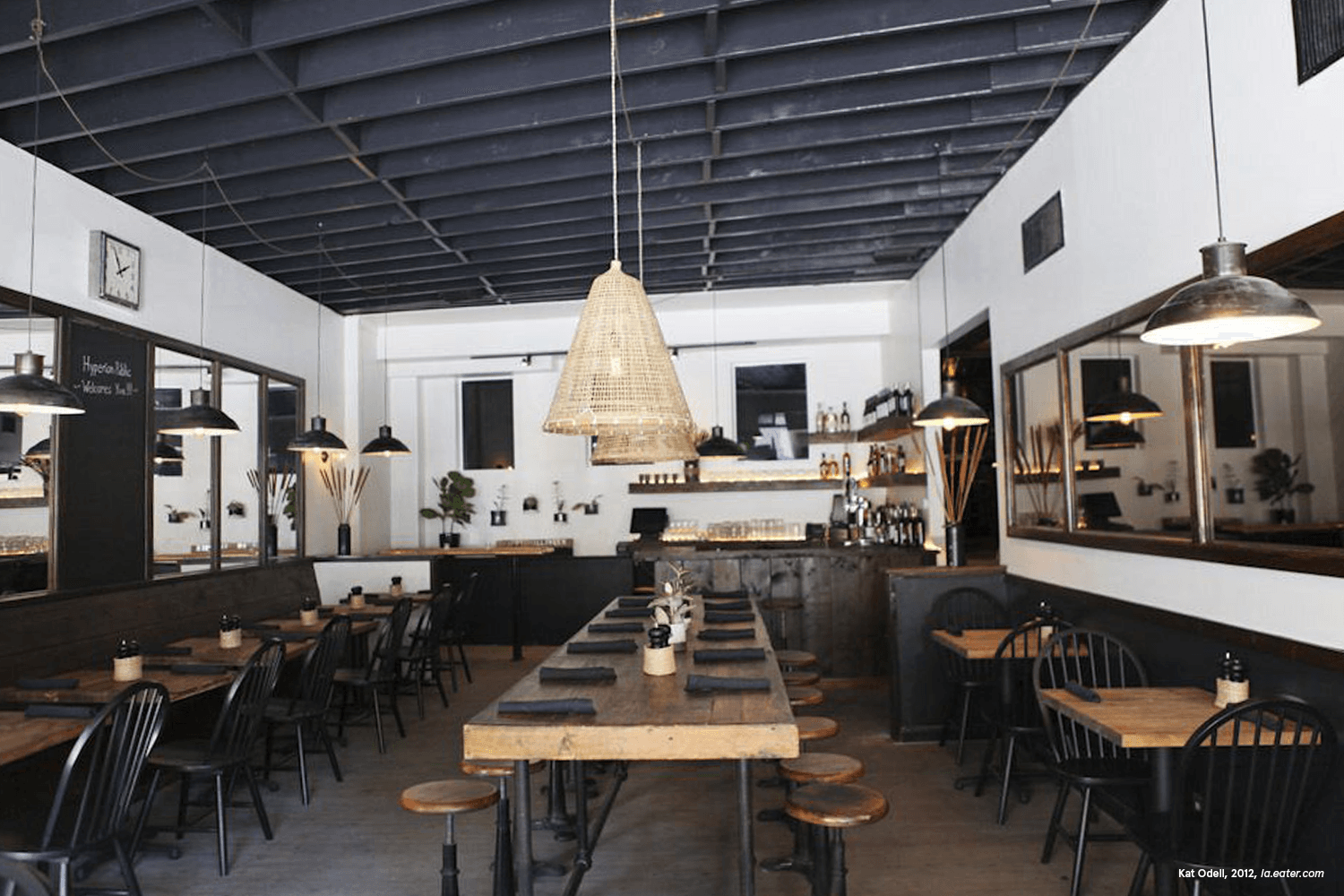 Cozy restaurant with wooden tables and modern decor.