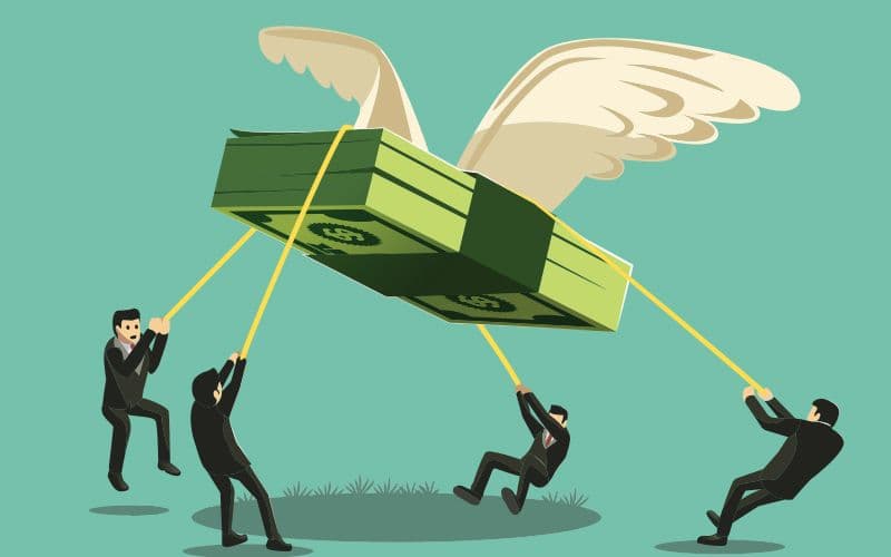 People pulling flying money stack on ropes