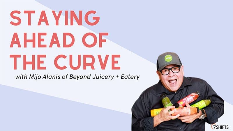 Man holding juices, staying ahead of the curve.