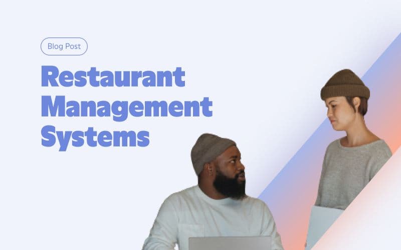 Two people discussing restaurant management systems