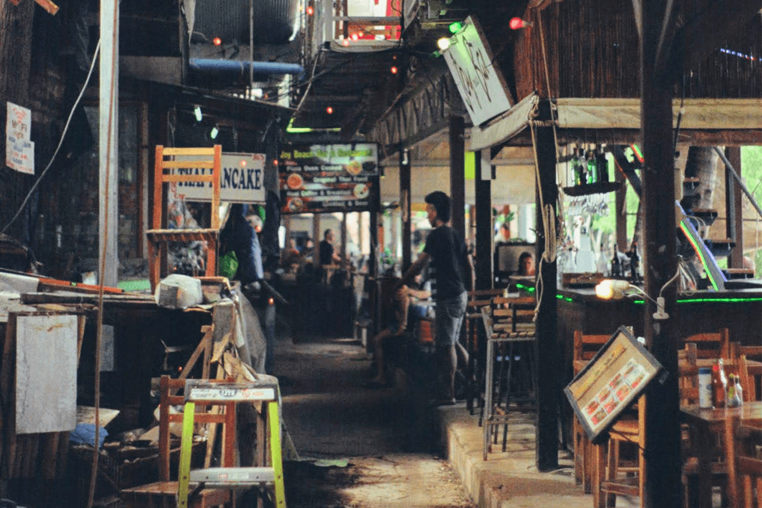 Busy street market with shops and people
