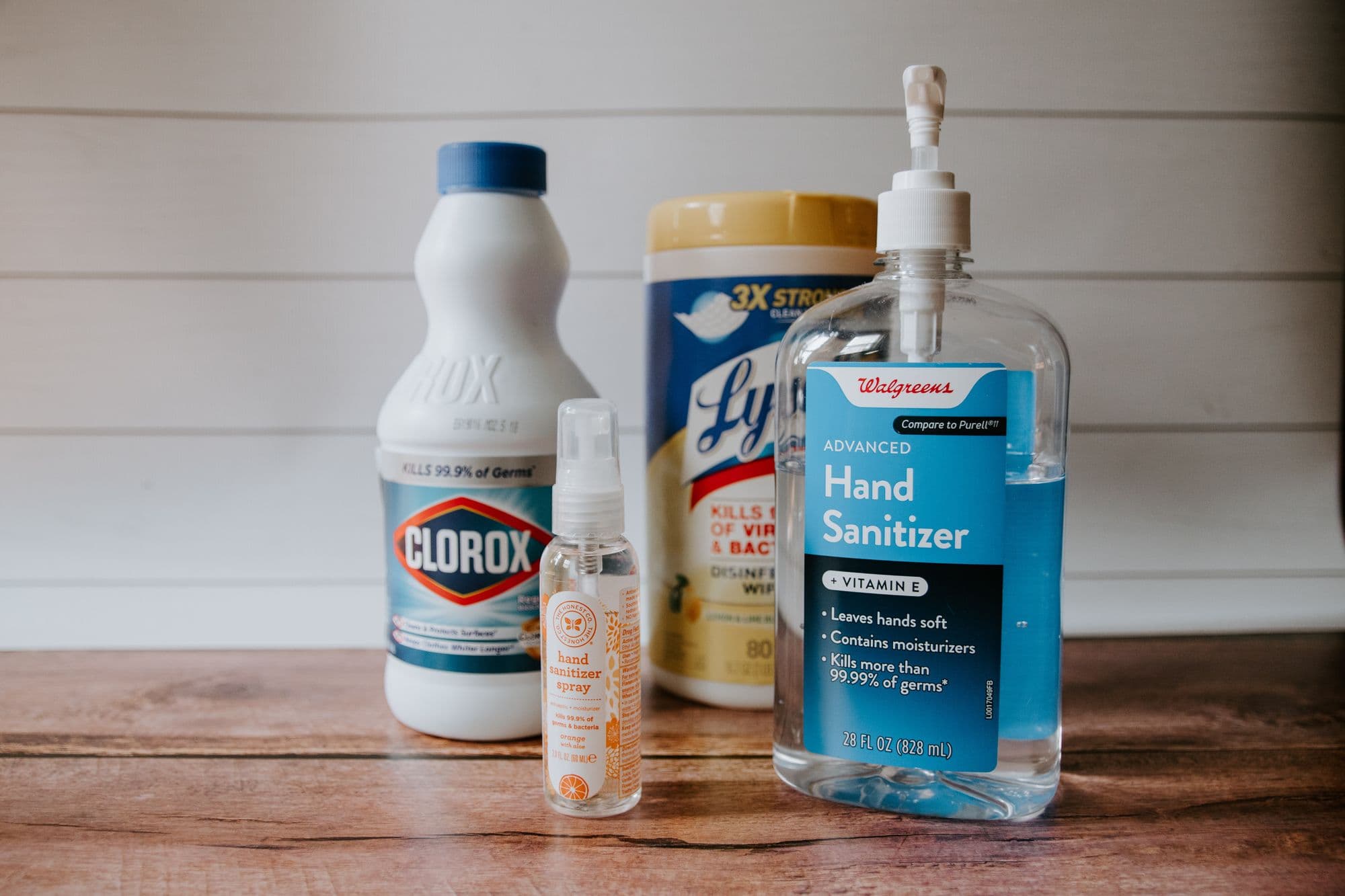 Cleaning and sanitizing products on wooden surface.