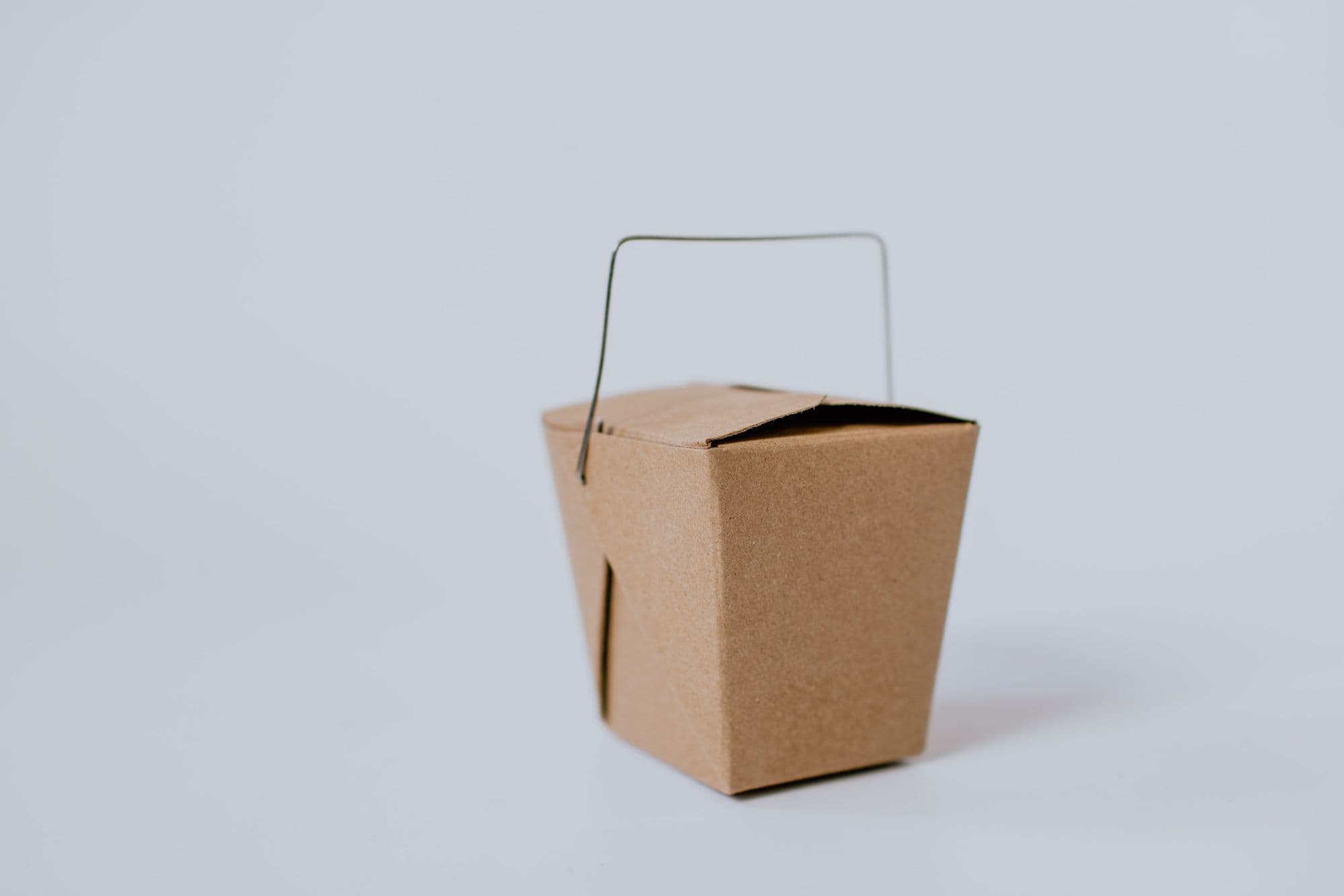 Brown takeout box with metal handle
