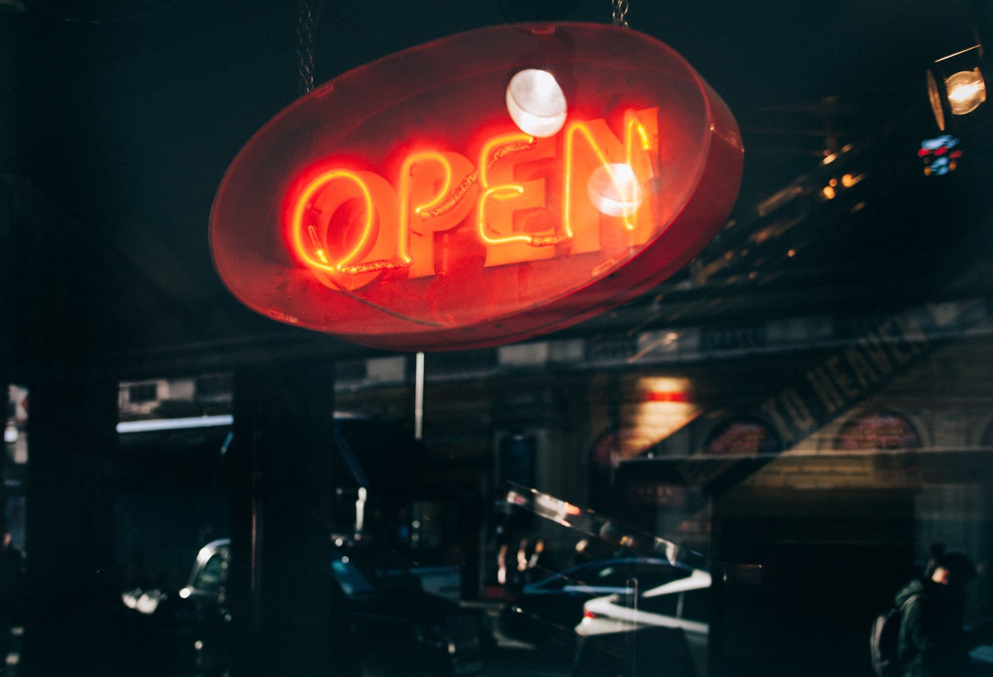Red neon open sign in window