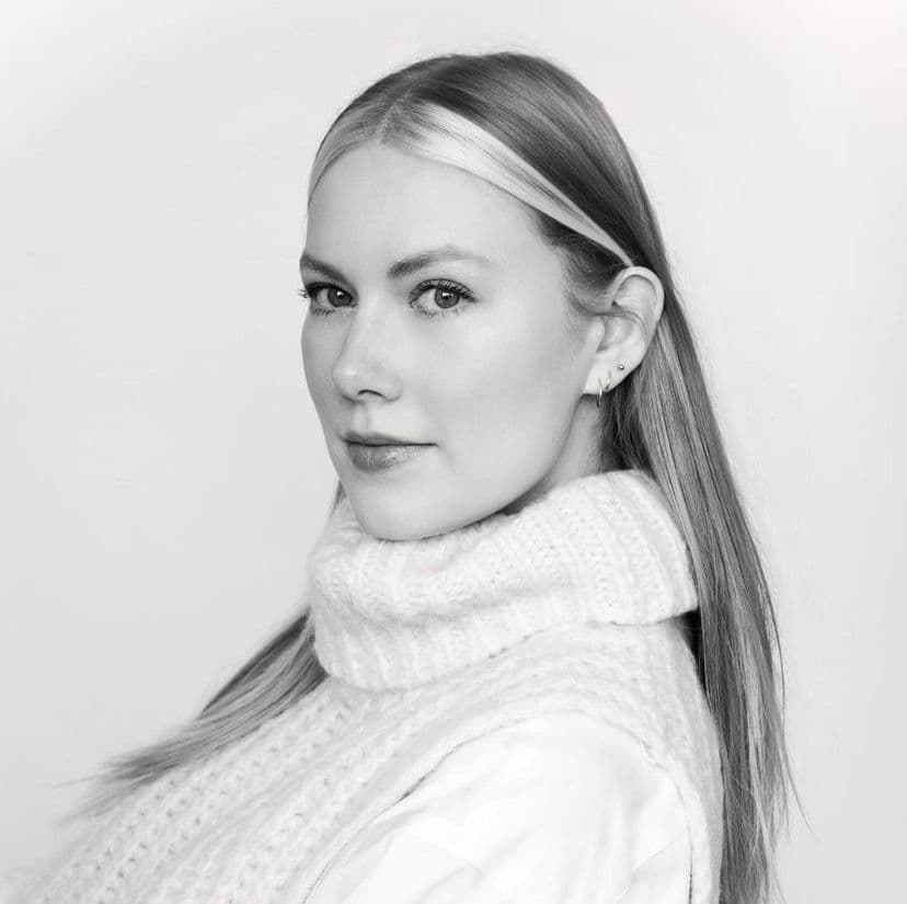 Woman in white sweater, black and white portrait