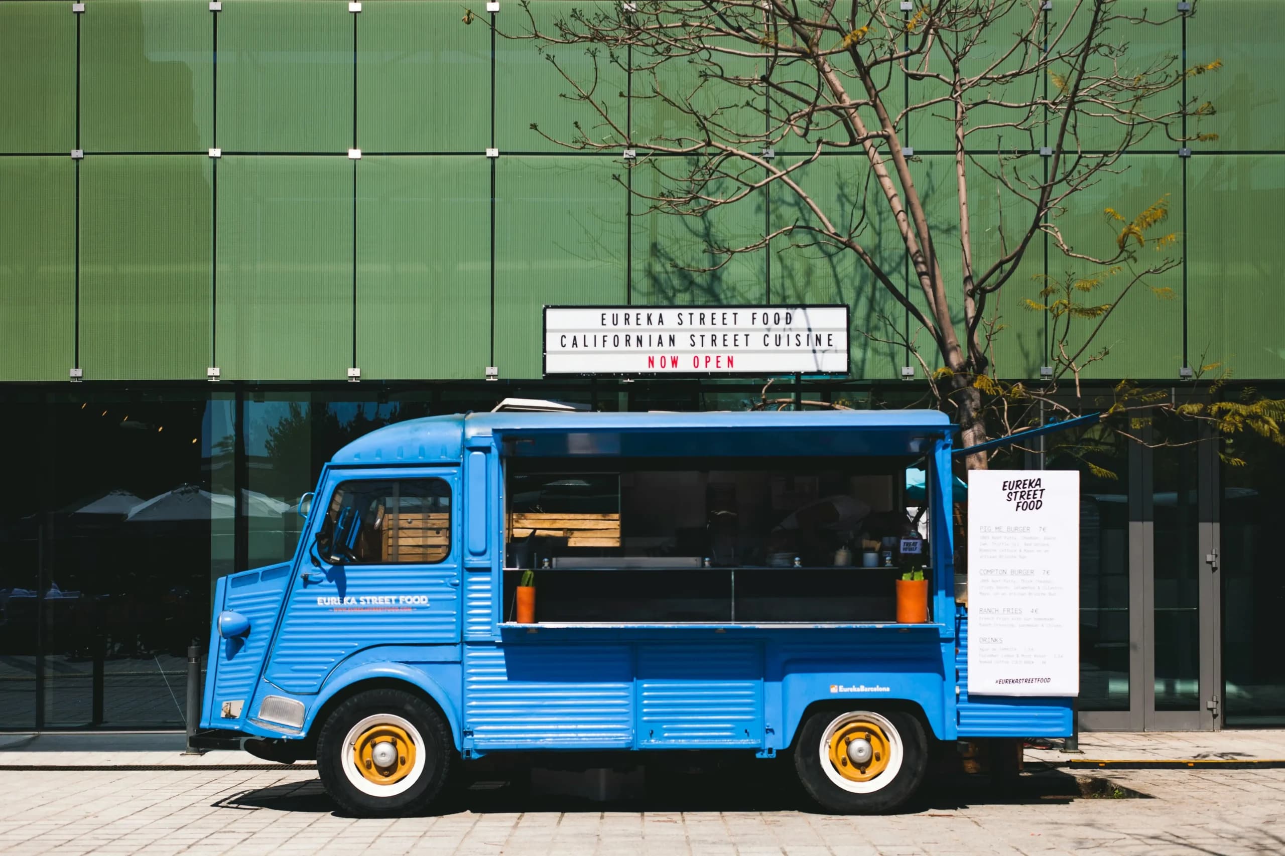 Blue food truck offering Californian street cuisine.