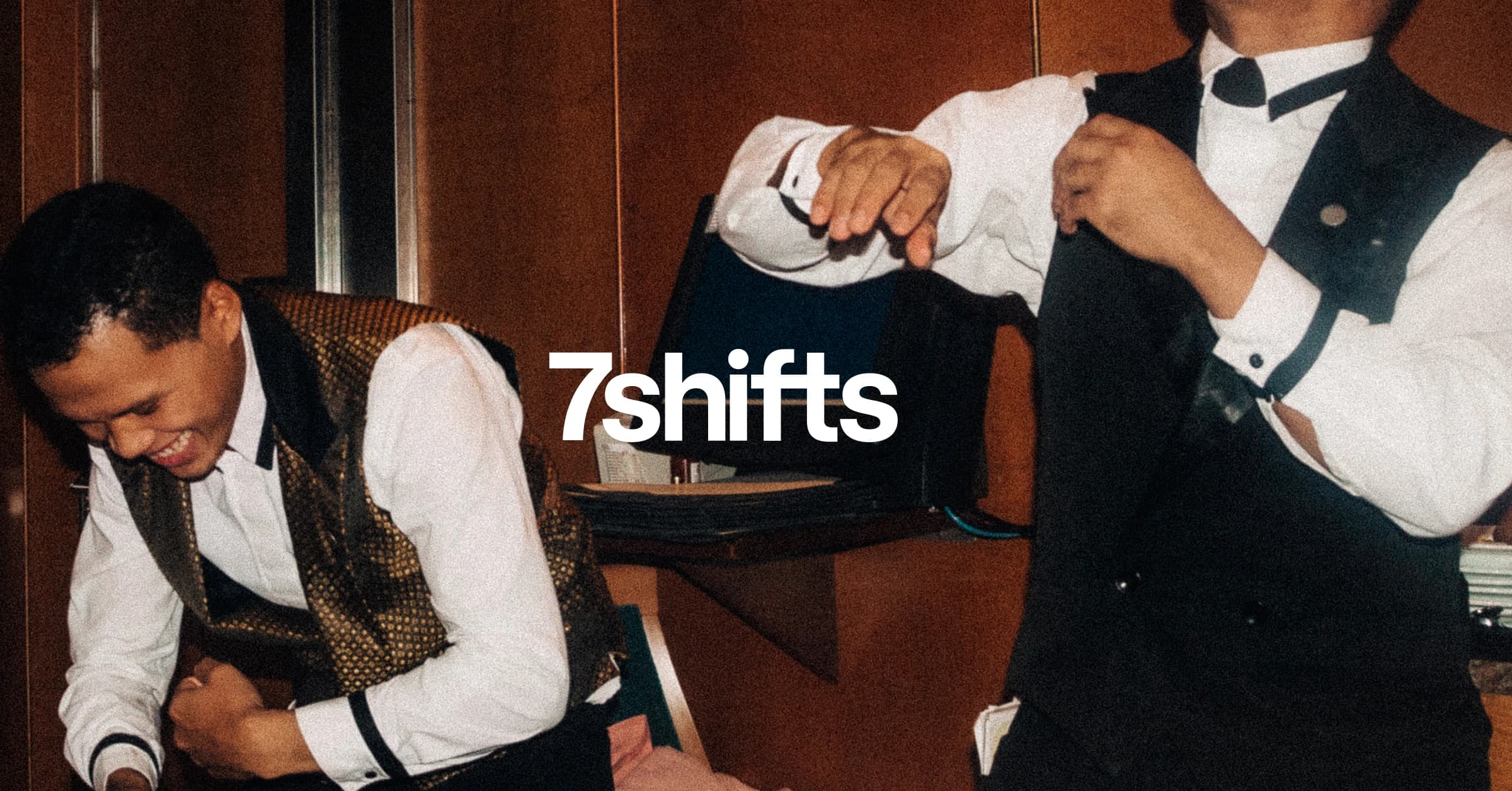 Two male servers in suits.