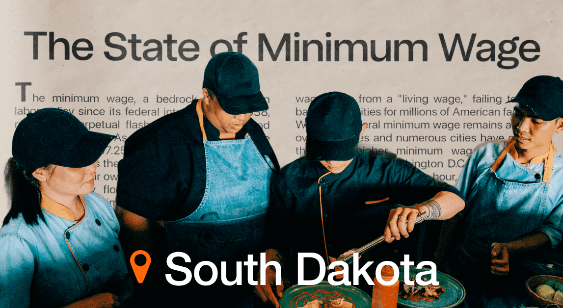 Workers in South Dakota discussing minimum wage article.