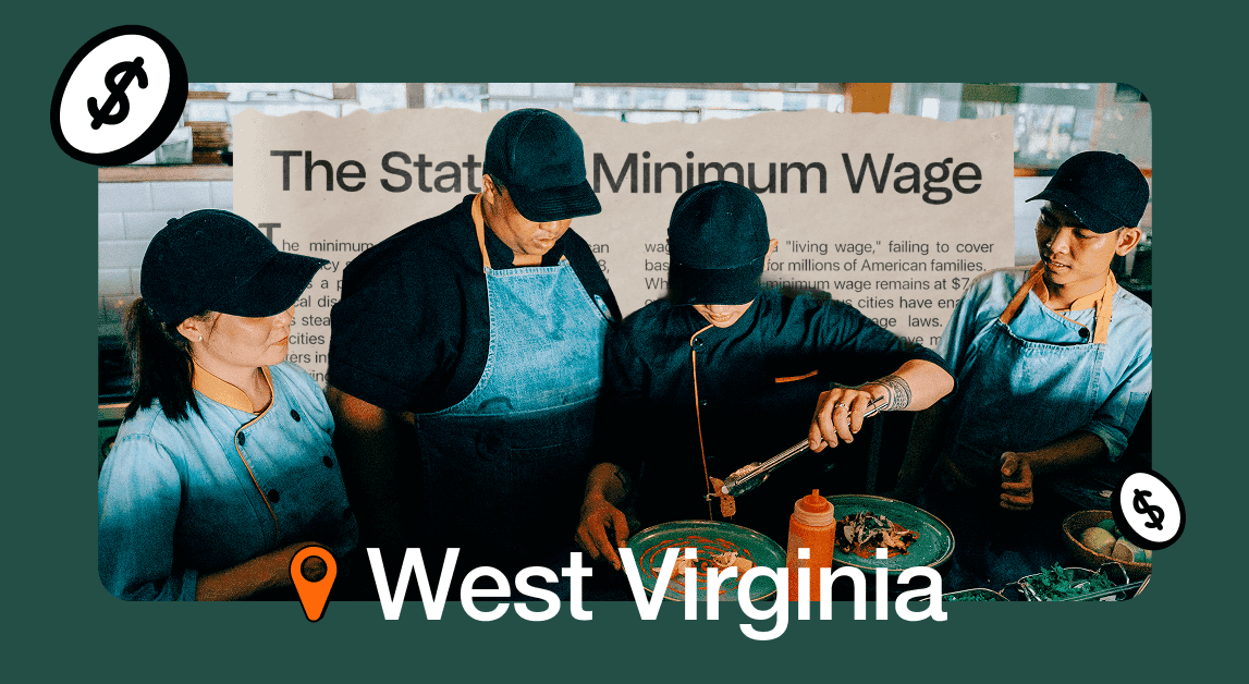 Workers in West Virginia prepare food under minimum wage sign.