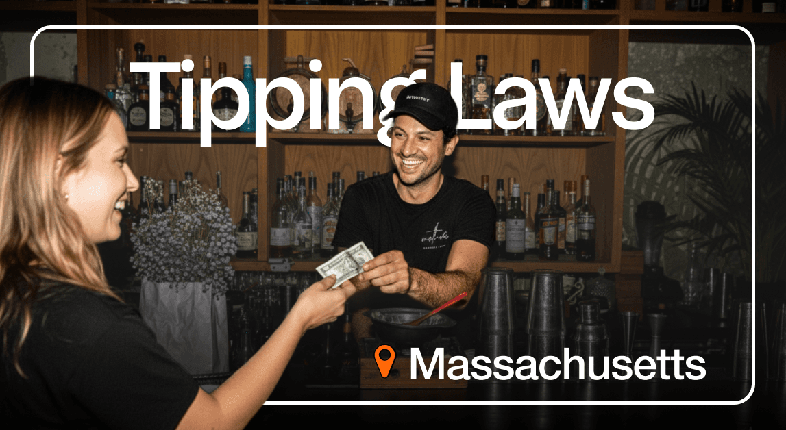 Smiling bartender receives tip, Massachusetts tipping laws.