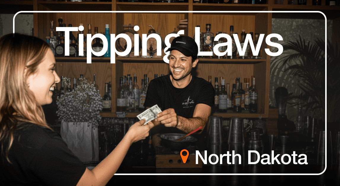 Bartender receiving tip, North Dakota tipping laws.