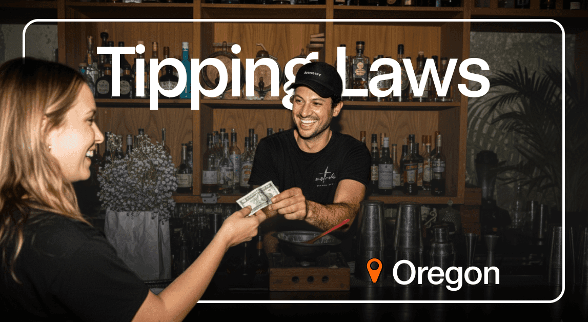 Bartender receiving tip in Oregon bar.