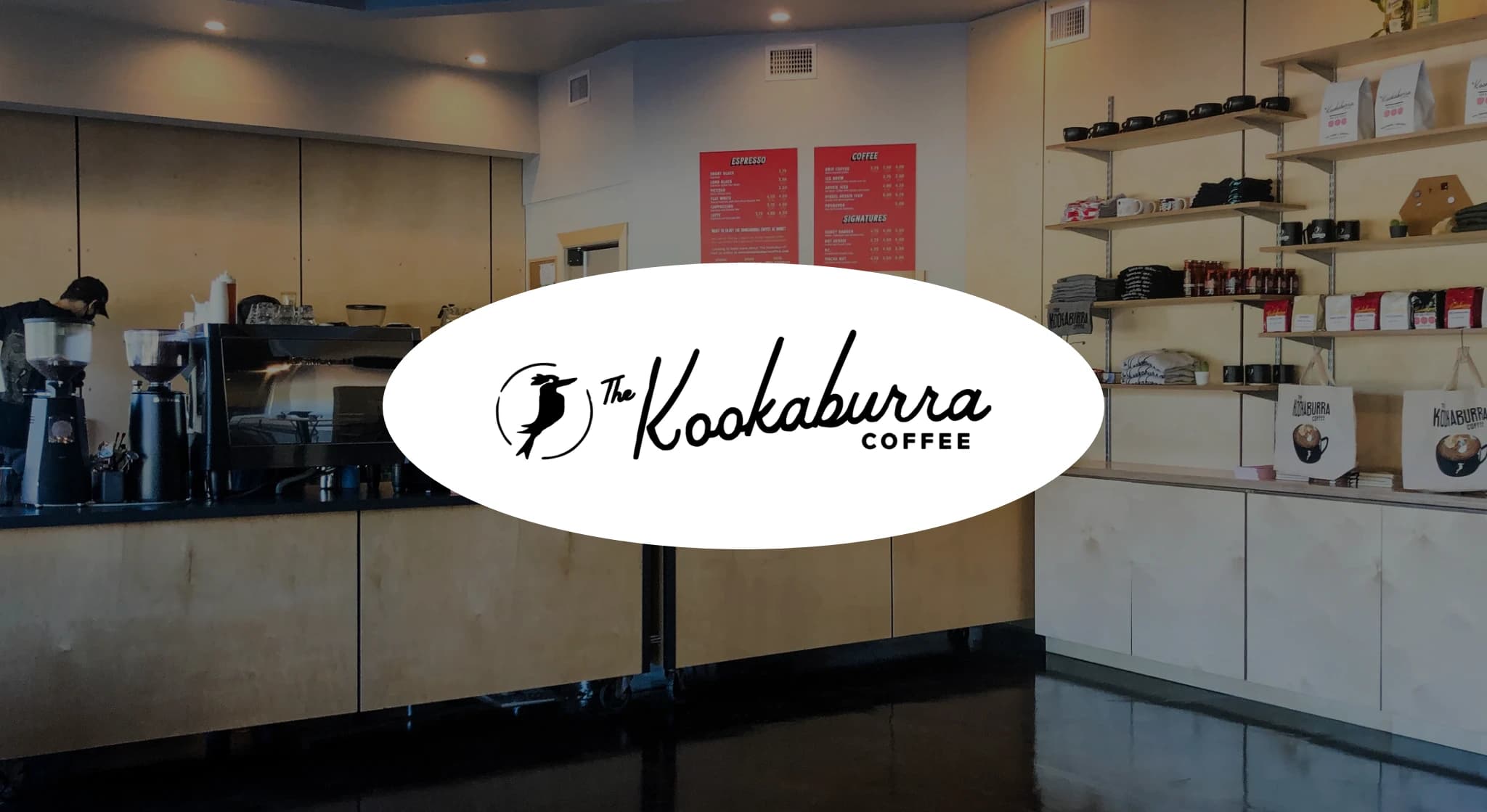 Kookaburra Coffee shop interior with counter and shelves.