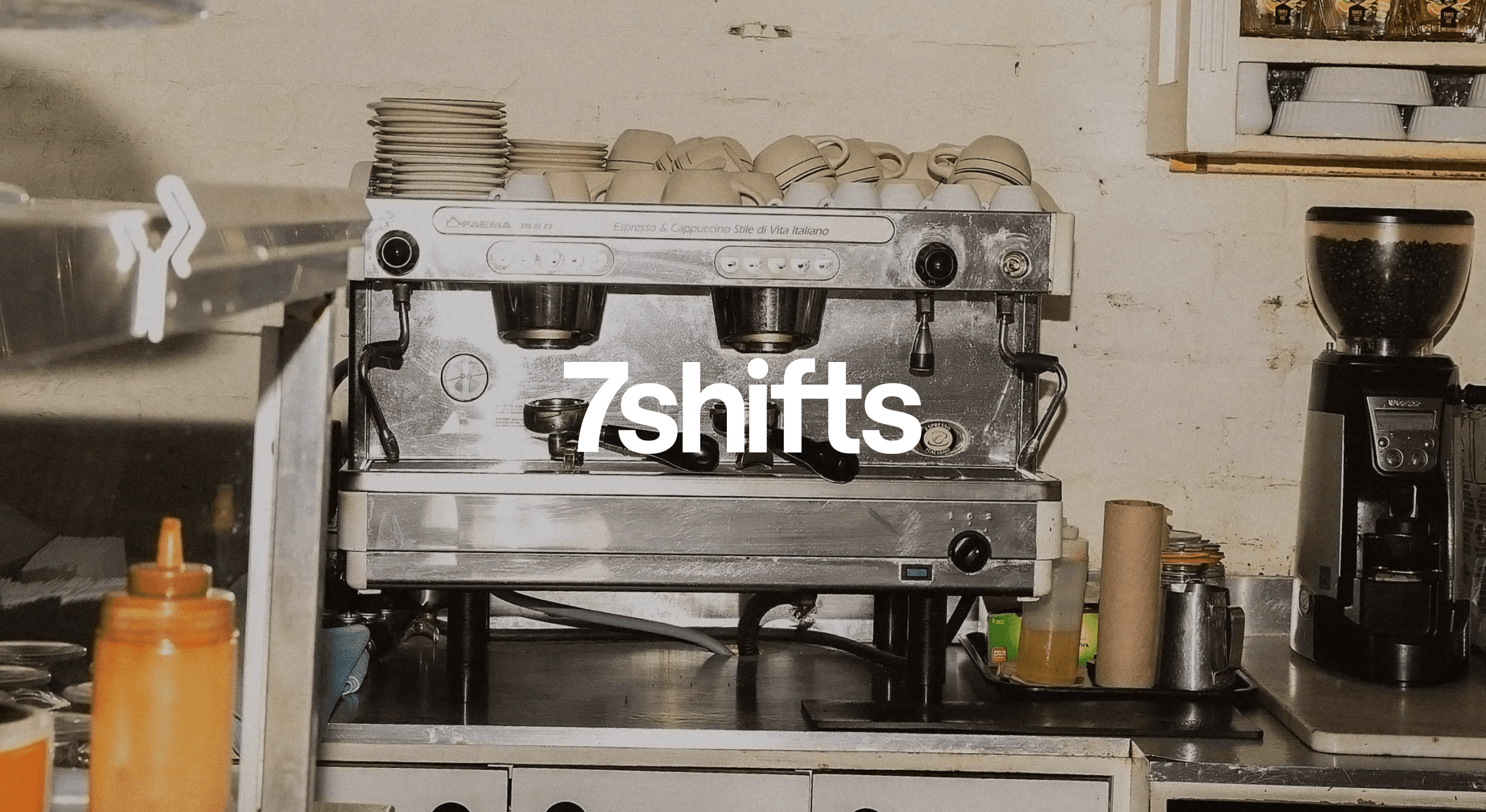 Commercial espresso machine in a coffee shop kitchen.