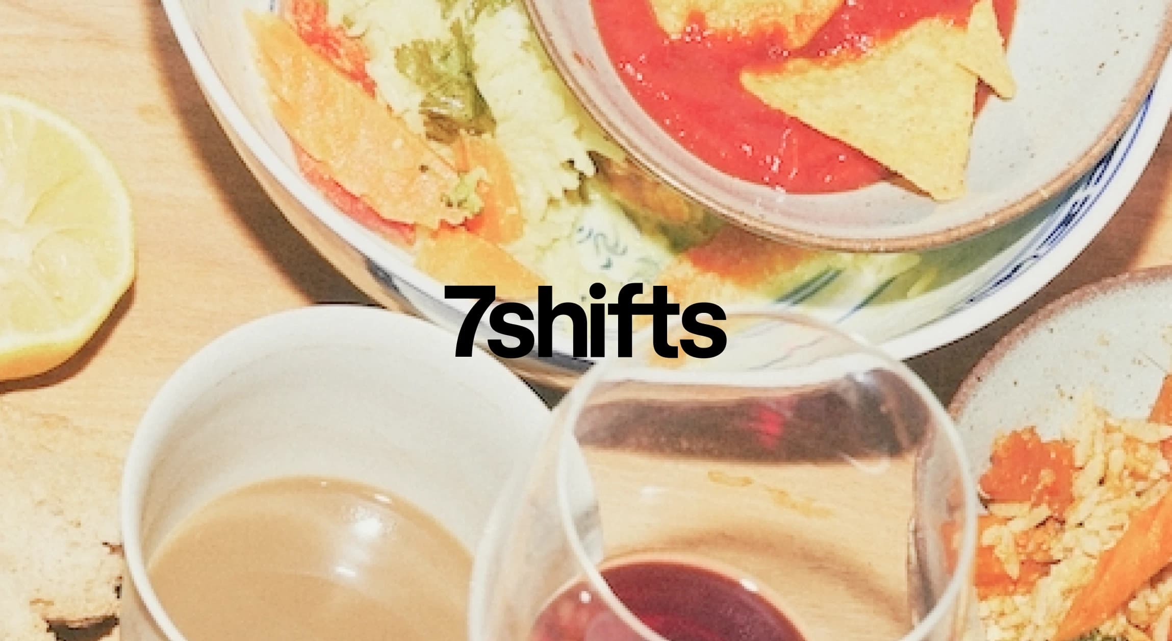 Restaurant food with drinks and 7shifts logo