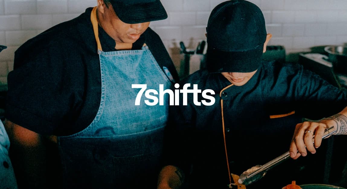 Two employees cooking in the kitchen