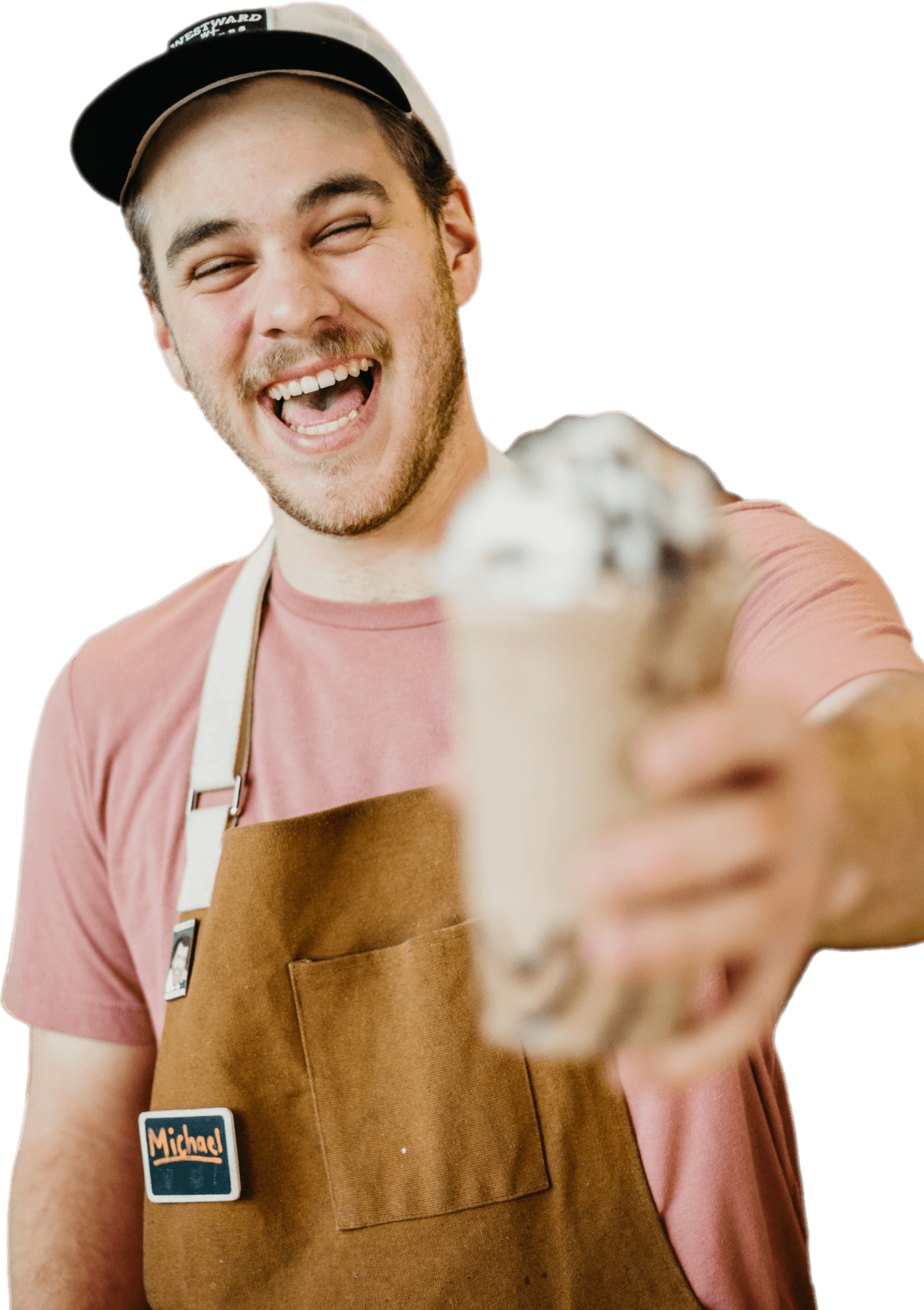 Smiling restaurnat mployee handing a customer an iced coffee beverage